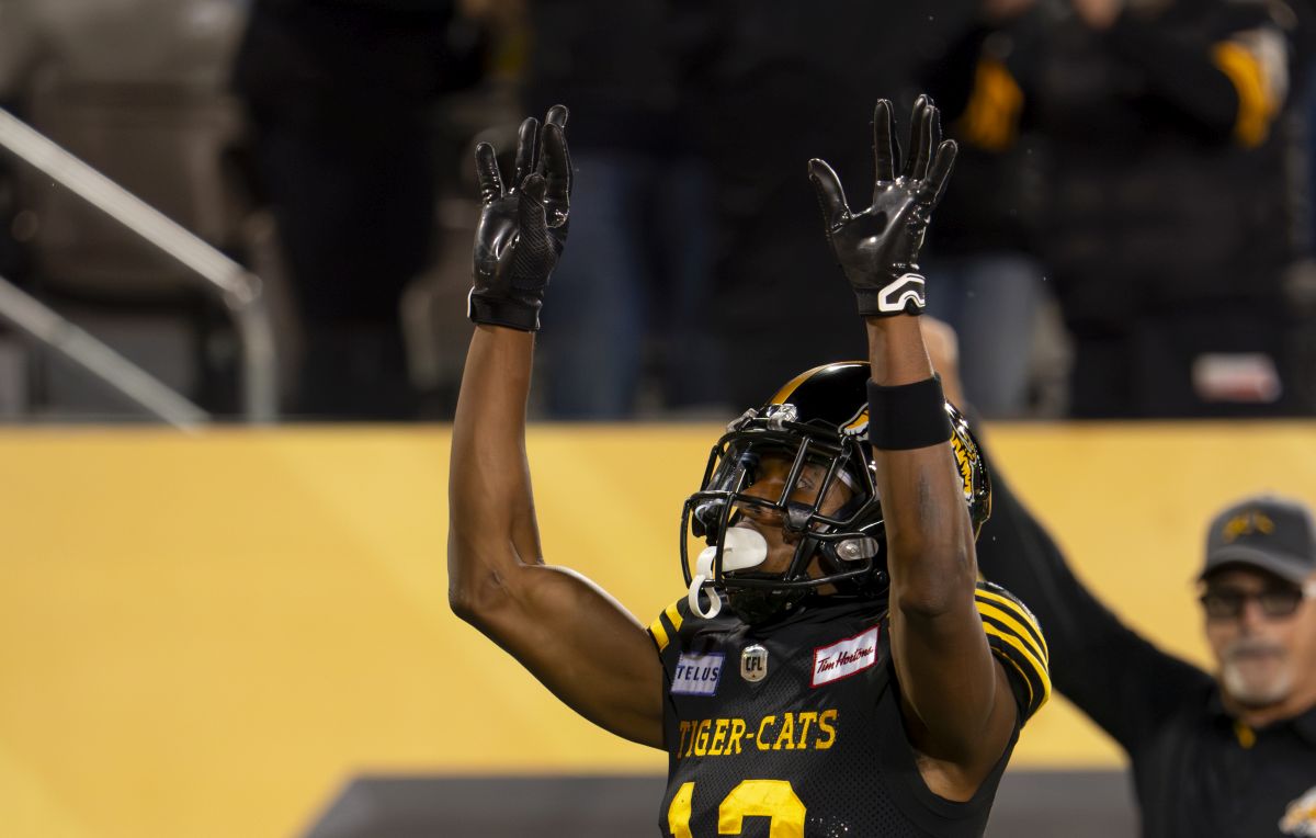 Hamilton Tiger-Cats wide receiver Tim White (12) celebrates his touchdown against the B.C. Lions during first half CFL football game action in Hamilton, Ont. on Friday, October 13, 2023.