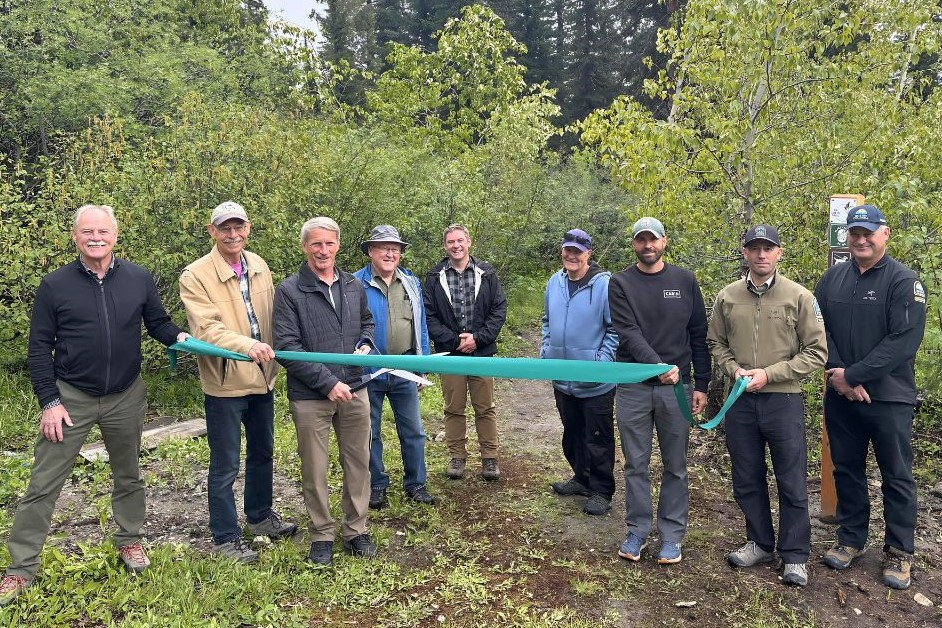 Area officials gather for the opening of the Upper BX Creek Trail near Silver Star Mountain.