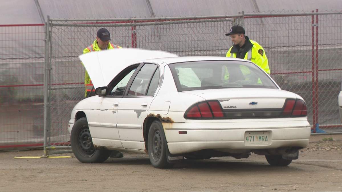 SPS inspecting a vehicle during the Light Vehicle Inspection Project