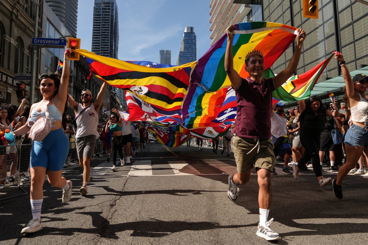 The Toronto Pride Parade will wind through the streets of the Ontario capital, with thousands expected to attend. Participants run with a multinations pride flag during  the Toronto Pride Parade, Sunday, June 25, 2023. THE CANADIAN PRESS/Chris Young.