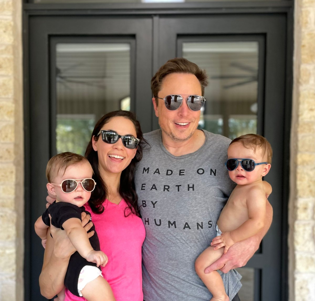 Elon Musk and Shivon Zilis holding their twins.