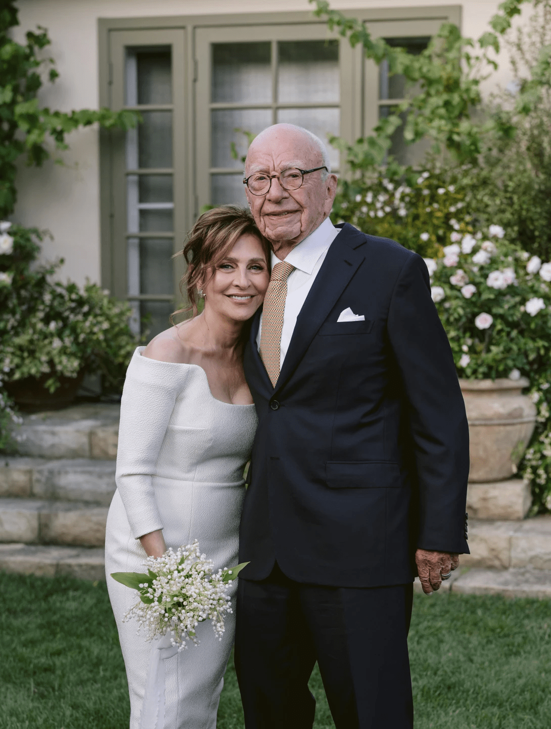 Rupert Murdoch standing close to Elena Zhukova in their wedding attire.