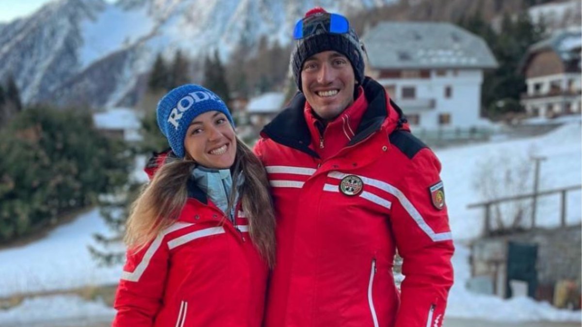 Elisa Arlian and Jean Daniel Pession in matching red ski jackets and tuques.
