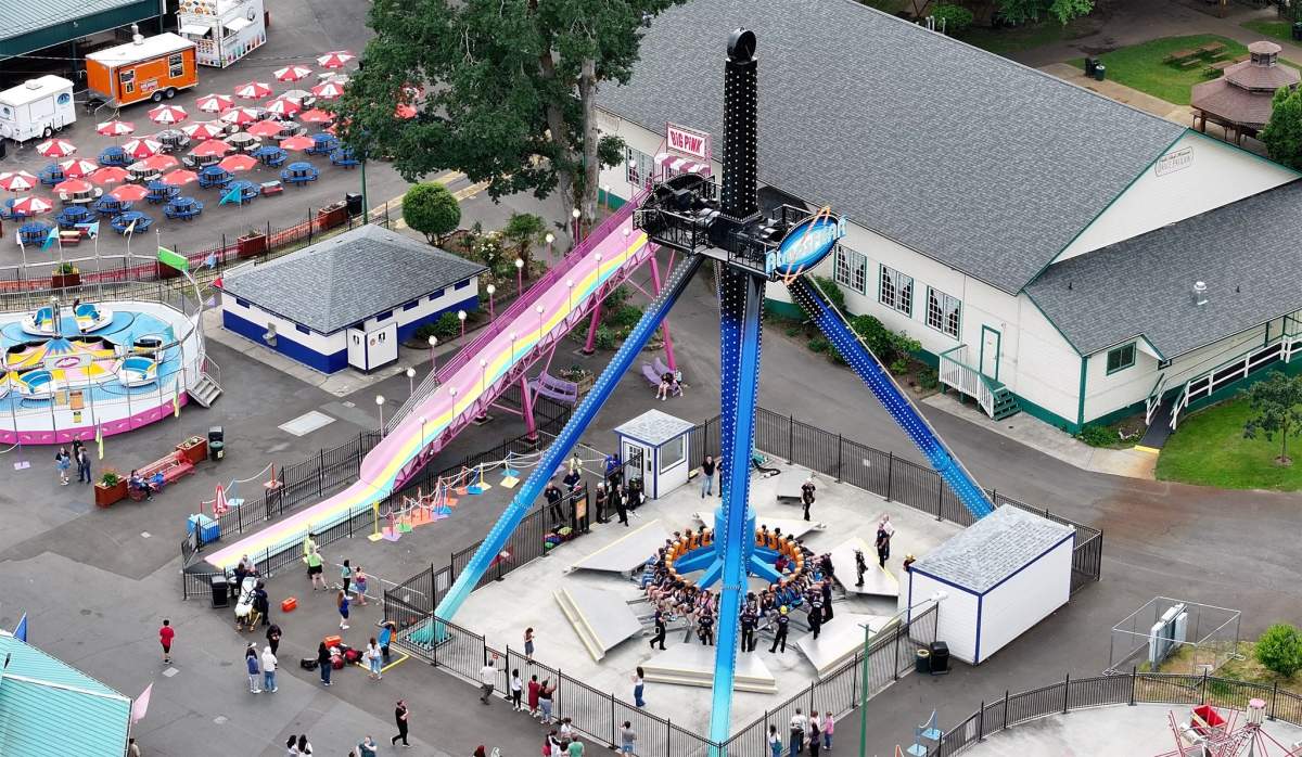 Aerial shot of the AtmosFEAR ride unloading patrons in the ground.