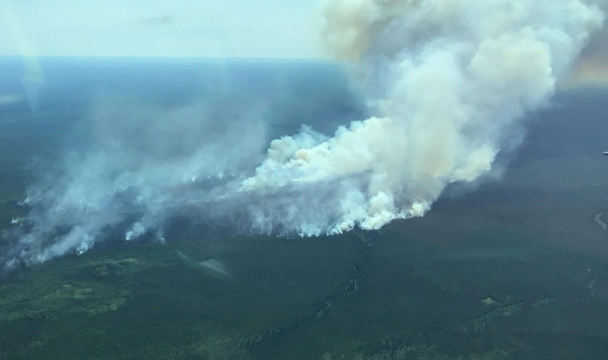 Suncor cuts production as wildfire burns out of control near oilsands site