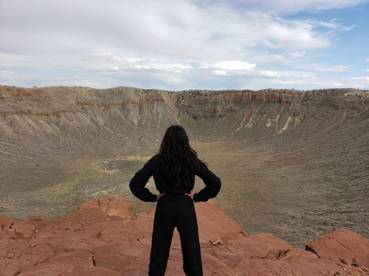 Dr. Shawna Pandya at Meteor Crater, AZ, during a 2019 Planetary Geology course with the International Institute for Astronautical Sciences.