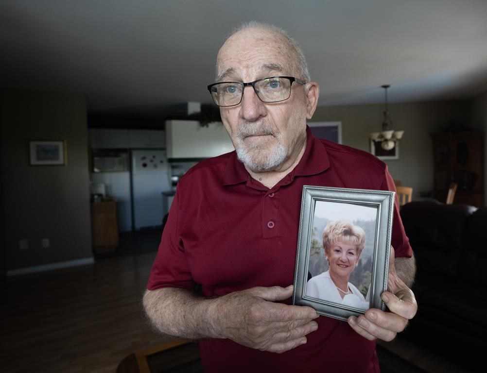 Jean-Luc Duval holds a picture of his late wife, Monique, in his home Friday, June 14, 2024, in Repentigny, Que.