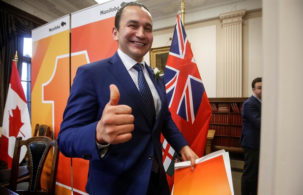 Manitoba Premier Wab Kinew gives a thumbs-up after he leaves a press conference before the provincial budget is read at the Manitoba legislature in Winnipeg, Tuesday, April 2, 2024. 