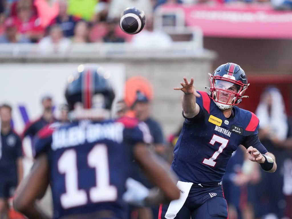 Montreal Alouettes quarterback Cody Fajardo (7) throws to wide receiver Kaion Julien-Grant (11) during first half CFL football action against Calgary Stampeders in Montreal, Saturday, July 6, 2024.