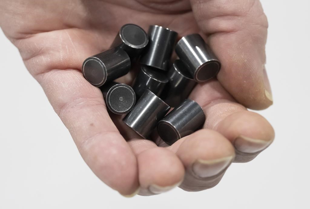 Uranium pellets, similar to those used to help power a nuclear reactor, are shown during a tour of a Nuclear Waste Management Organization facility in Oakville, Ont. on Tuesday, Dec.12, 2023.