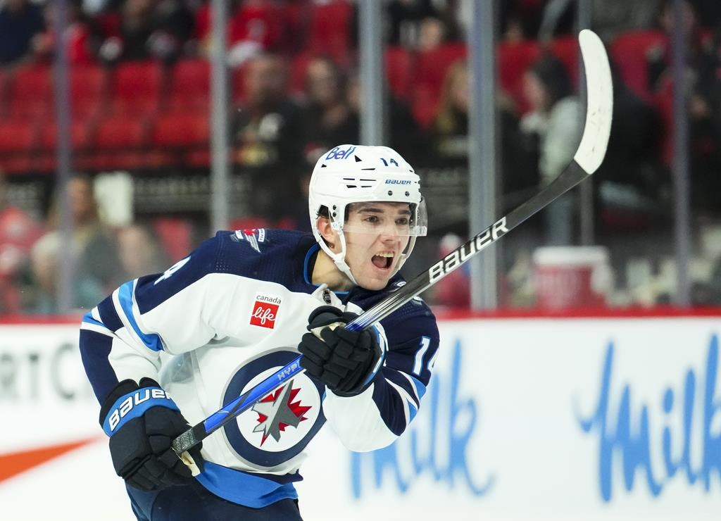 Winnipeg Jets defenceman Ville Heinola (14) takes a shot on net while taking on the Ottawa Senators in first period pre-season NHL hockey action in Ottawa on September 29, 2023. THE CANADIAN PRESS/Sean Kilpatrick.