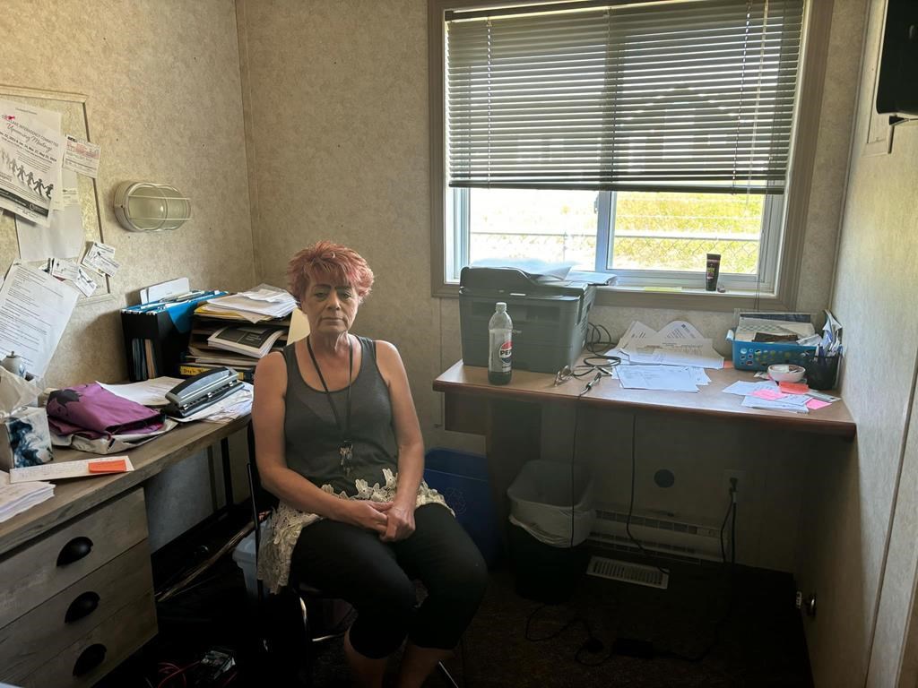 Woman sits at desk