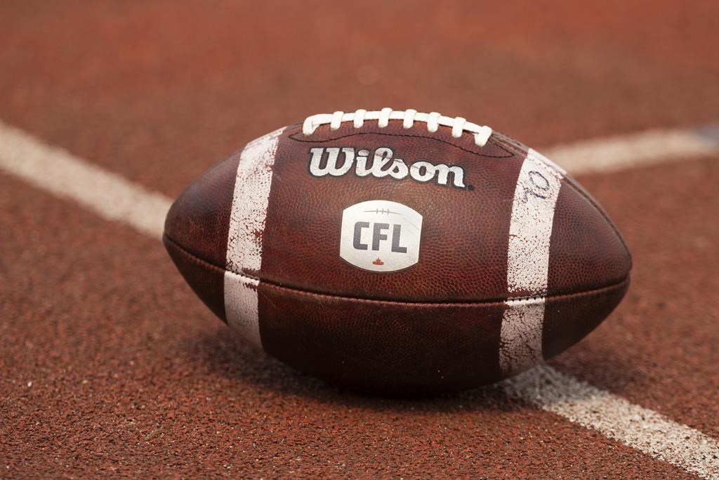 Canadian Football League logo seen on a football during CFL training camp at Alumni Stadium in Guelph, Ont., on May 12, 2024. THE CANADIAN PRESS/Nick Iwanyshyn.