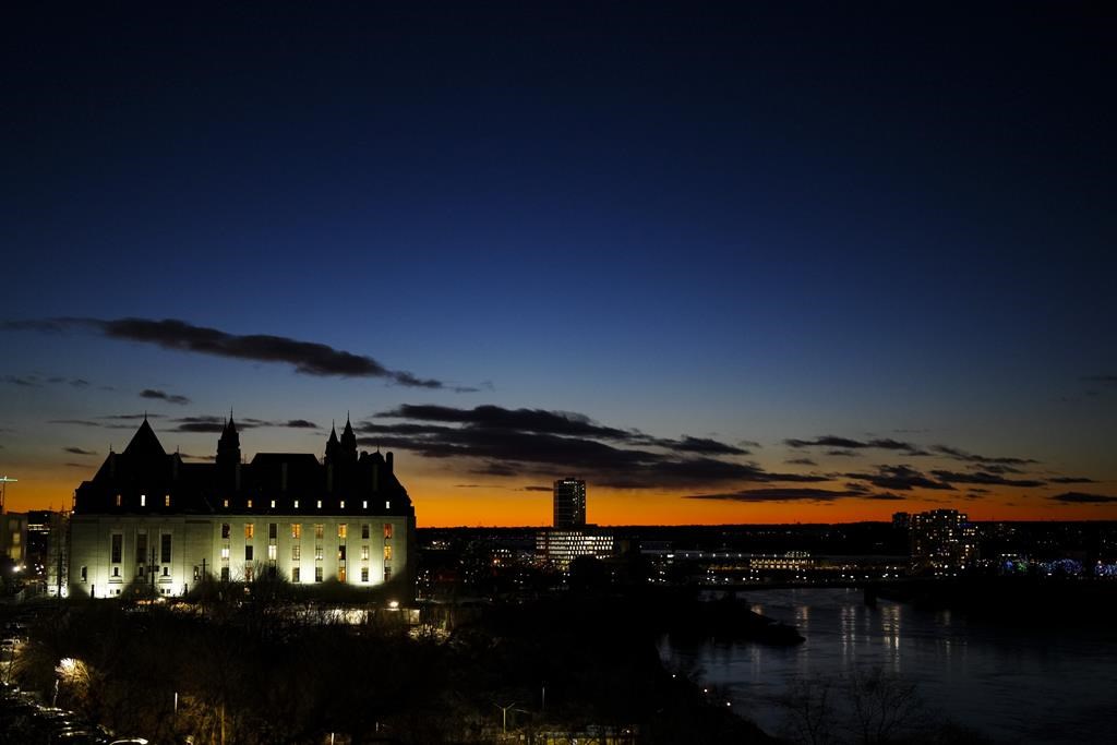 The Supreme Court of Canada is pictured at sunset in Ottawa on Wednesday, Dec. 13, 2023. A B.C. judge says trial delays for a man accused of sexually assaulting a six-year-old girl went beyond a "ceiling" set by the Supreme Court of Canada, tossing the case more than two years after he was charged. THE CANADIAN PRESS/Sean Kilpatrick.