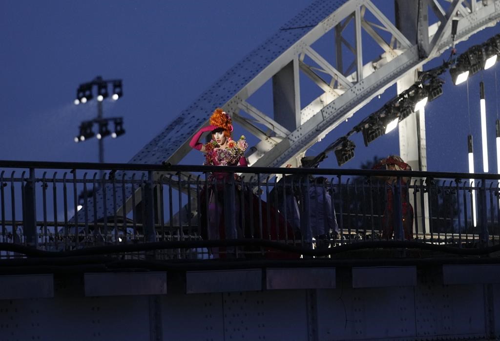 Drag queens prepare to perform on the Debilly Bridge in Paris, during the opening ceremony of the 2024 Summer Olympics, Friday, July 26, 2024