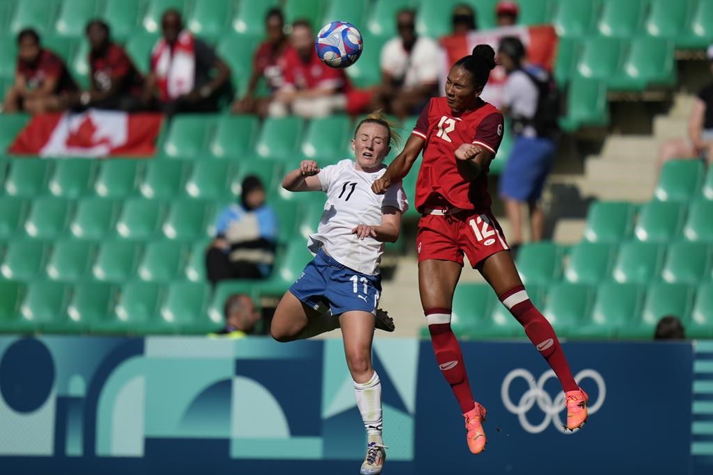 Canadian sports fans in Paris are using words like "embarrassing" and "disappointing" to describe their reactions a drone spying scandal that has rocked Canada Soccer in the early days of the Olympic Games. New Zealand's Katie Kitching, left, and Canada's Jade Rose vie for the ball during the women's Group A soccer match between Canada and New Zealand at Geoffroy-Guichard stadium during the 2024 Summer Olympics, Thursday, July 25, 2024, in Saint-Etienne, France. THE CANADIAN PRESS/AP/Silvia Izquierdo.