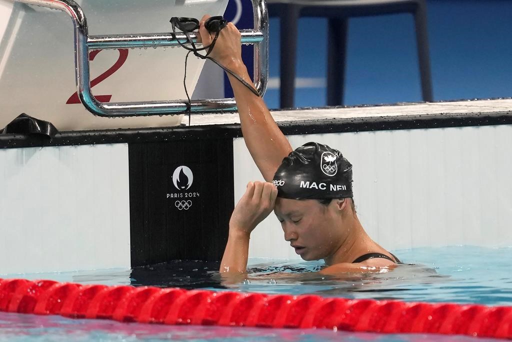 Margaret Mac Neil, of Canada, reacts after swimming in the women's 100m butterfly finals at the 2024 Summer Olympics, Sunday, July 28, 2024 in Nanterre, France. THE CANADIAN PRESS/Adrian Wyld.