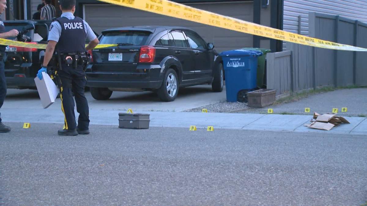 Police investigate after two homes were shot at in Airdrie, Alta., on July 29, 2024.