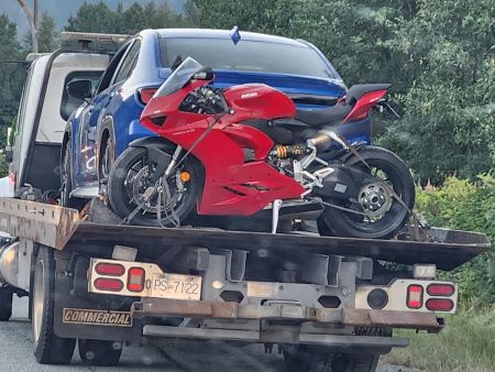 A blue sedan and a motorbike are impounded after being caught for excessive speeding in Squamish, B.C.