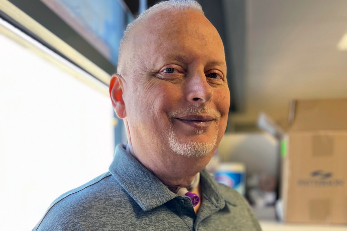 In this photo provided by the Mayo Clinic, Marty Kedian poses for a photo in Mayo Clinic’s Head and Neck Regenerative Medicine Laboratory in Scottsdale, Ariz., on June 12, 2024. Kedian regained his voice after surgeons removed his cancerous larynx and, in a pioneering move, immediately replaced it with a donated one. (Mayo Clinic via AP)