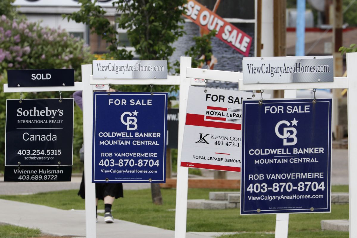 Residential real estate signs are seen in Calgary, Alberta on June 28, 2022, 2022.