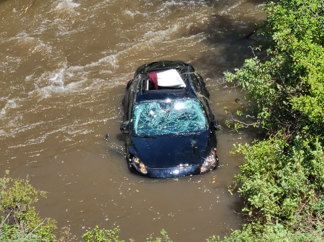 The damaged car in Hat Creek that British tourists Mark and Janet Brimicombe were rescued from.