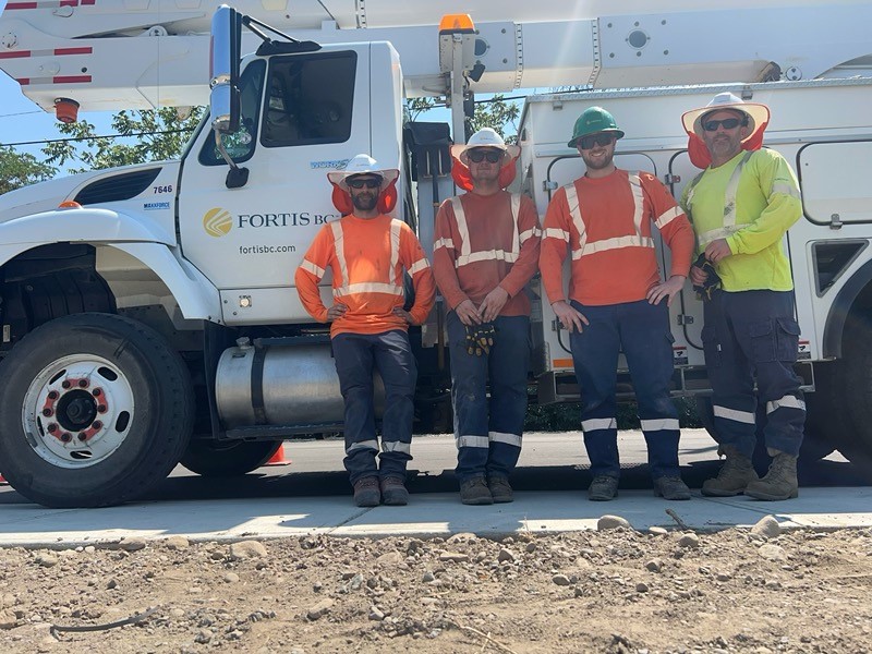 FortisBC crew members Brock Giles (left), Sam Hall, Rob McKinnon and Kurtis Kriese assisted the Lower Similkameen Indian Band members in putting out a fire at their cemetery.