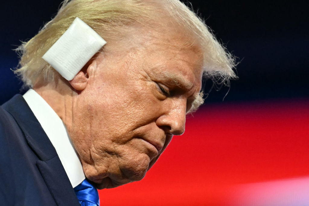 US former President and 2024 Republican presidential candidate Donald Trump, a bandage on his ear after being wounded in an assassination attempt, departs at the conclusion of the second day of the 2024 Republican National Convention at the Fiserv Forum in Milwaukee, Wisconsin, July 16, 2024.