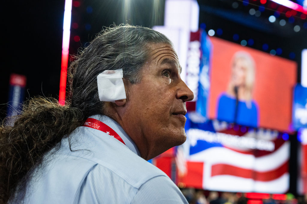 Arizona delegate Ray Michaels wears an ear bandage in solidarity with Donald Trump, the Republican presidential nominee, in the Fiserv Forum on the third night of the Republican National Convention in Milwaukee, Wis., on Wednesday July 17, 2024.