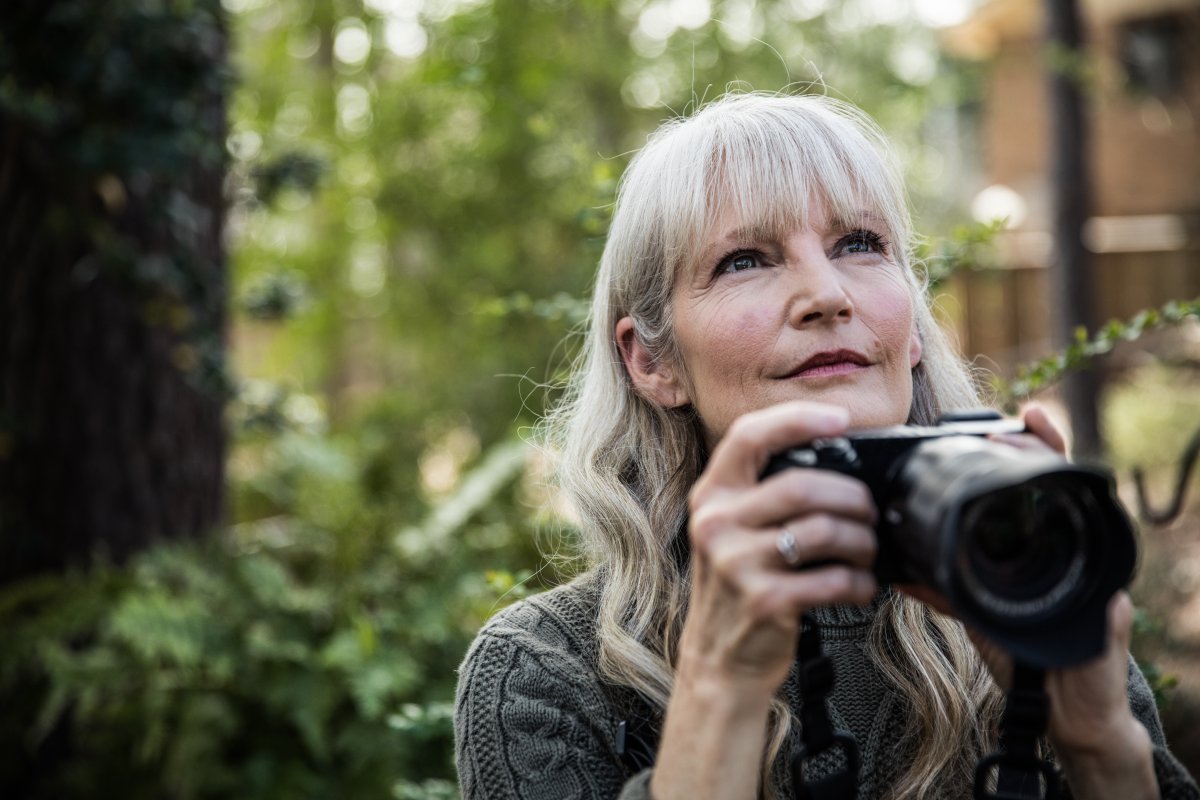 Woman holding professional camera