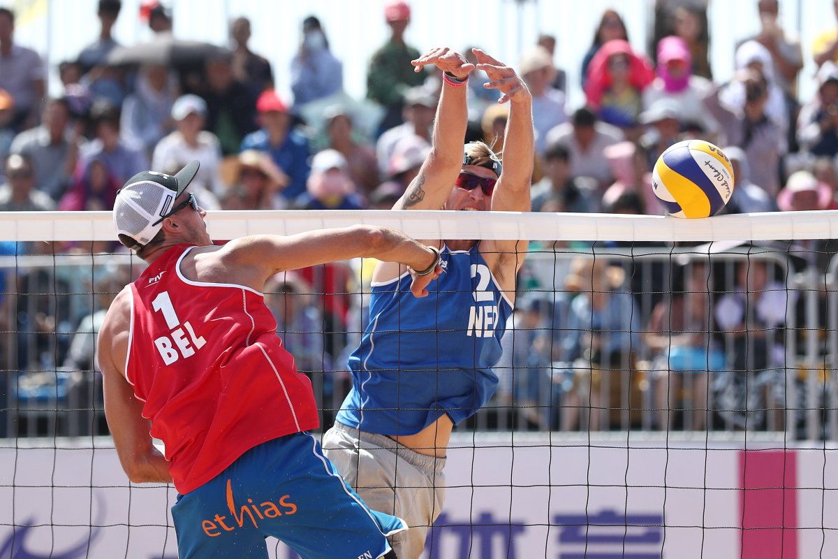 Steven van de Velde of the Netherlands playing with Dirk Boehle of Netherlands during a match against Dries Koekelkoren and Tom van Walle of Belgium on Day 4 of the FIVB Beach Volleyball World Tour Qinzhou Open on October 14, 2017 in Qinzhou, China.