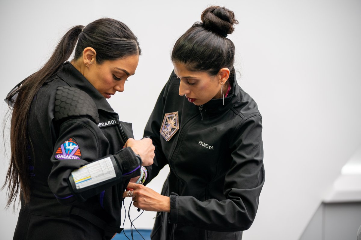 Dr. Shawna Pandya prepares crewmate Kellie Gerardi for spaceflight as the medical lead for the IIAS-01 mission.