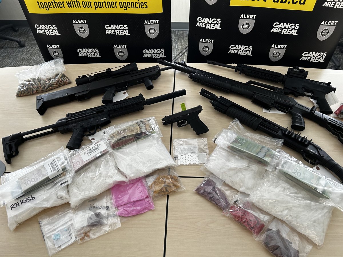 ALERT Calgary seized six firearms and more than $300,000 of drugs after a search warrant was conducted on two homes. Five people have been charged.