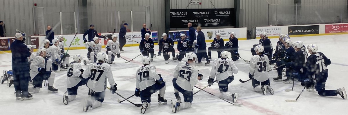 Jets prospects listen to coaches instructions at development camp .