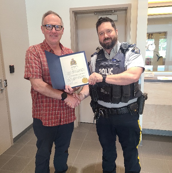 Ken MacKenzie, left, accepting his award.