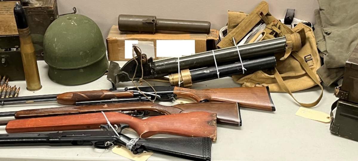 Guns, ammunition and and military equipment seized from a property in Mountain View County on July 25, 2024.