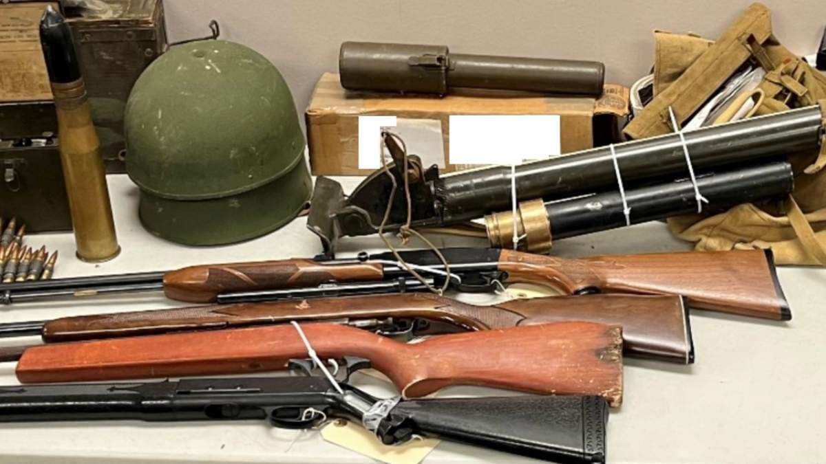 Guns, ammunition and and military equipment seized from a property in Mountain View County on July 25, 2024.