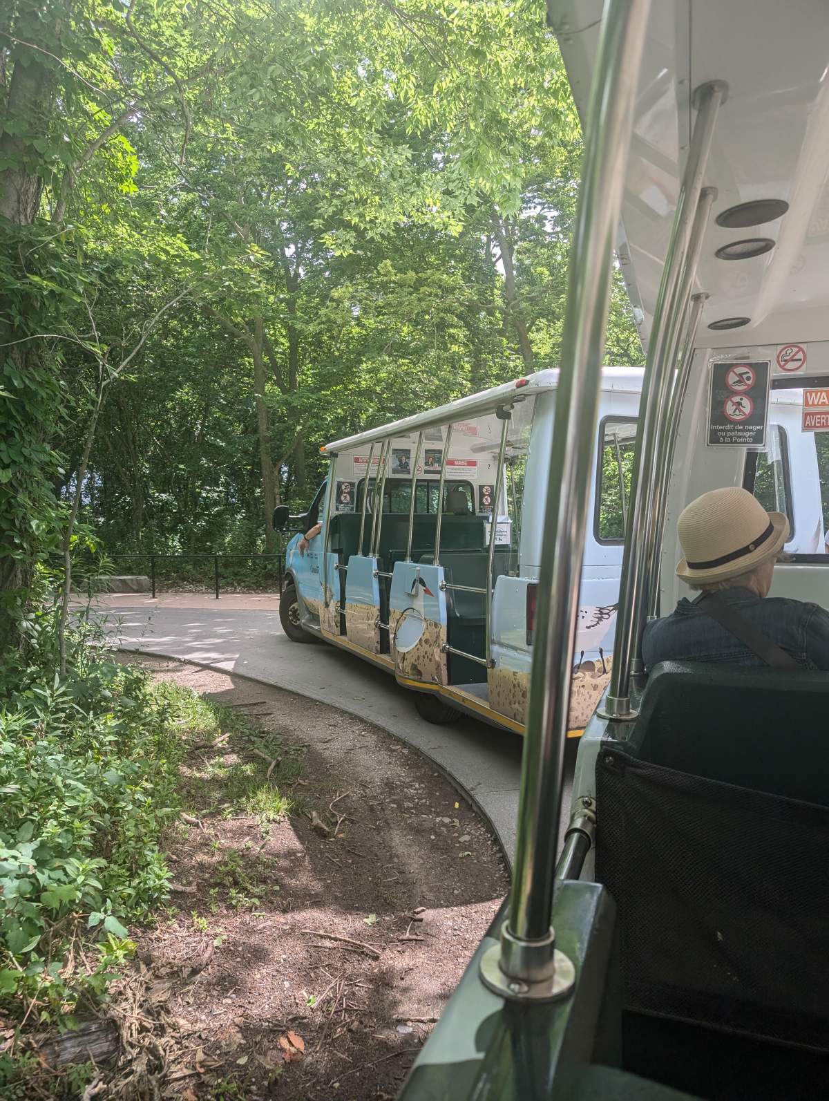 A shuttle bus turning a corner.