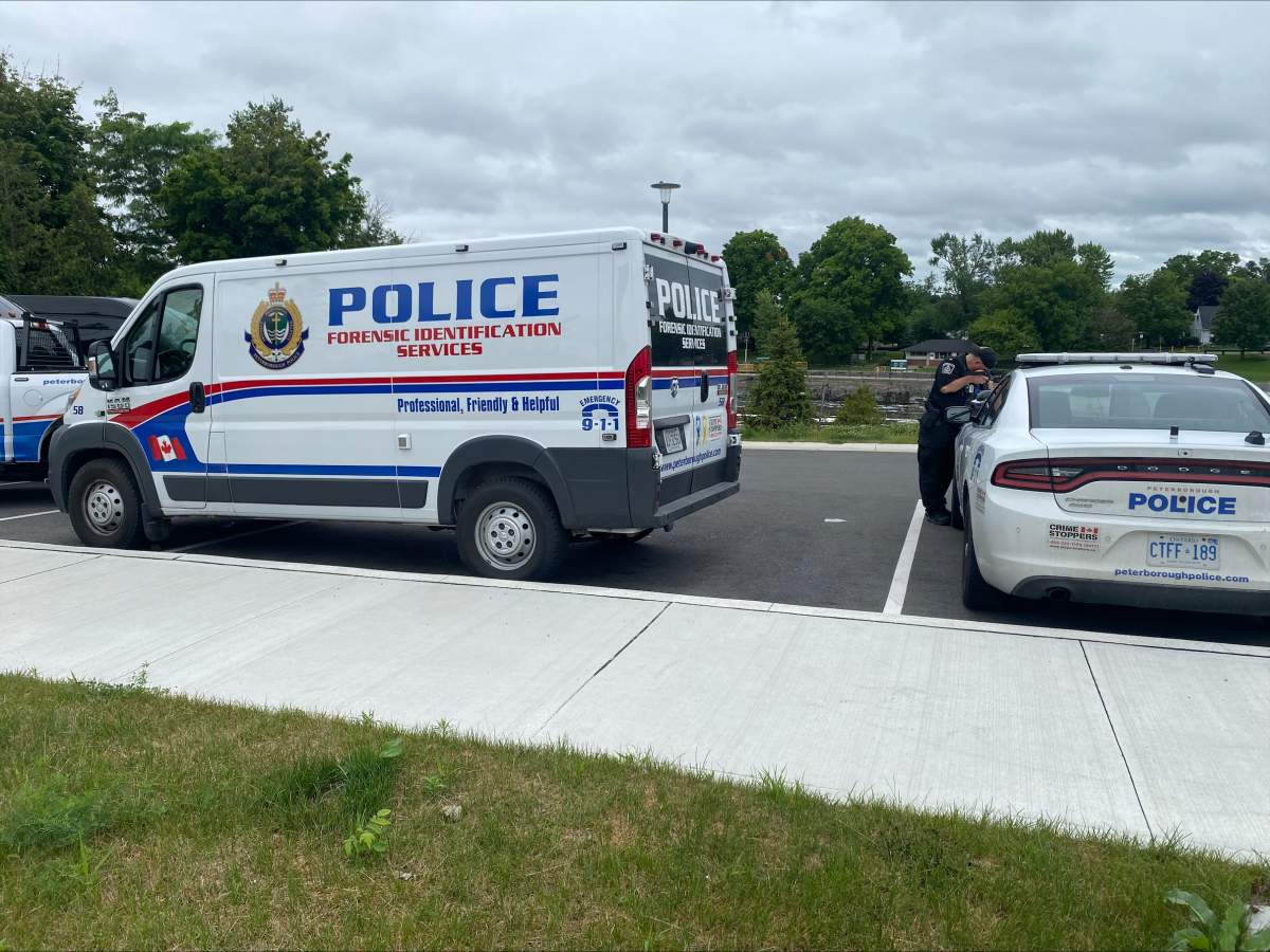 A Peterborough Police Service forensic van and a cruiser are near Lock 19 of the Trent-Severn Waterway on July 11, 2024.