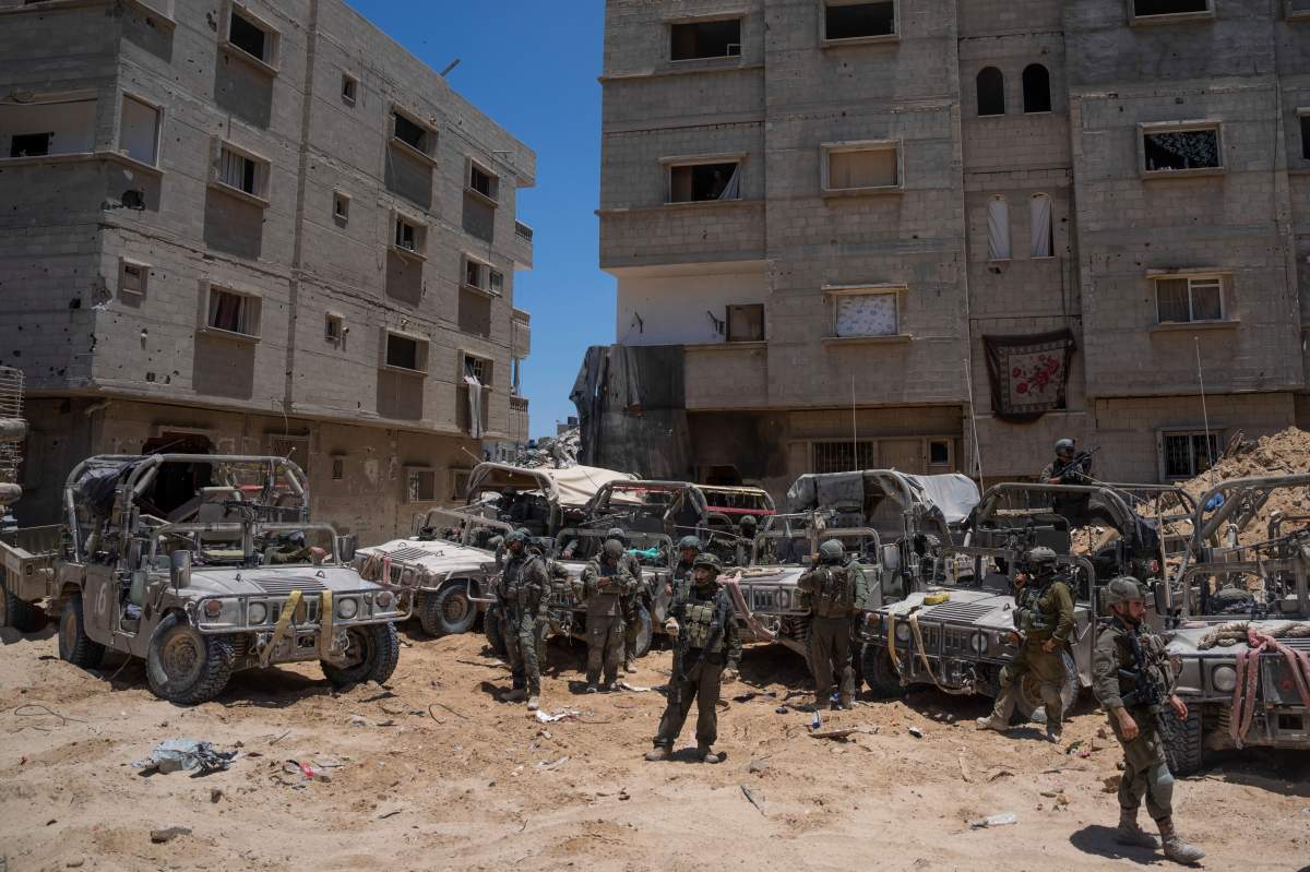 Israeli soldiers gather in the southern Gaza Strip