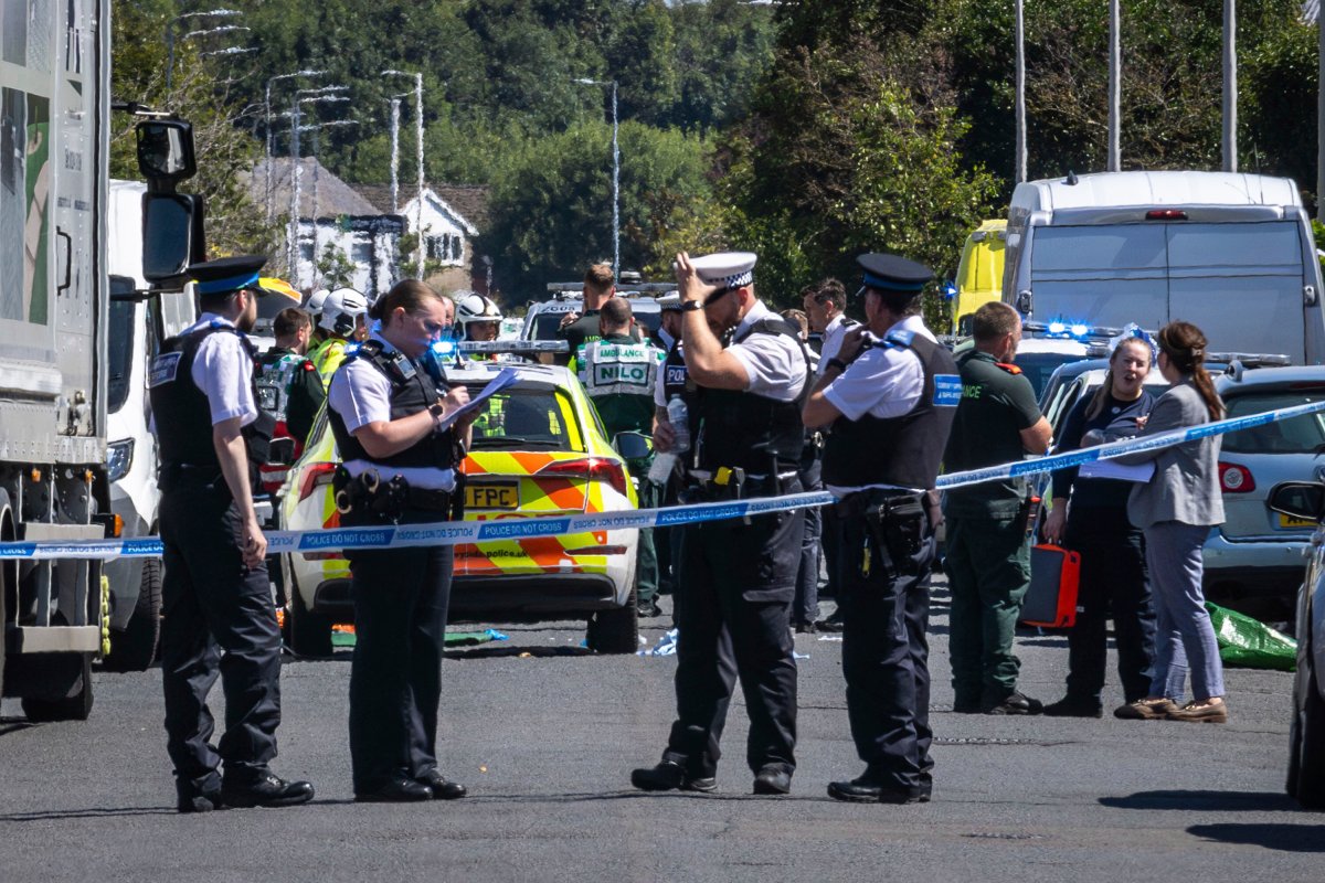 Police secure the area, where a man has been detained and a knife has been seized after a number of people were injured in a reported stabbing, in Southport, Merseyside, England, Monday July 29, 2024.