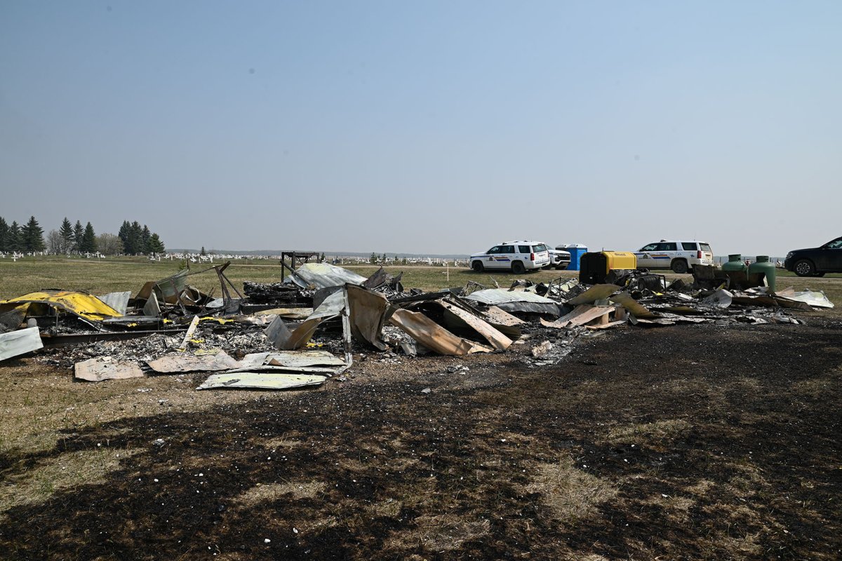 An ATCO Trailer destroyed by fire at the Sacred Heart Cemetery, near the historical location of the Sacred Heart/Blue Quills Residential School near St. Paul, Alta. on May 11, 2024.