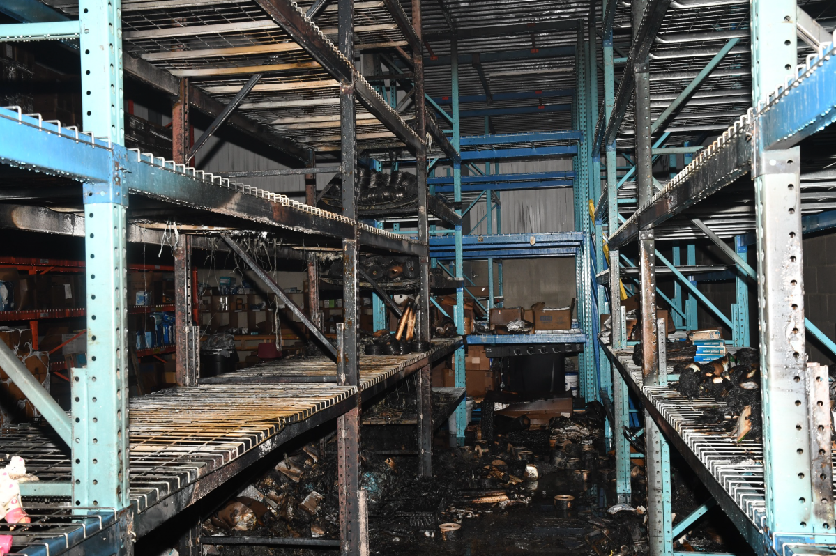 An aisle in Global Health Imports' warehouse after the arson.