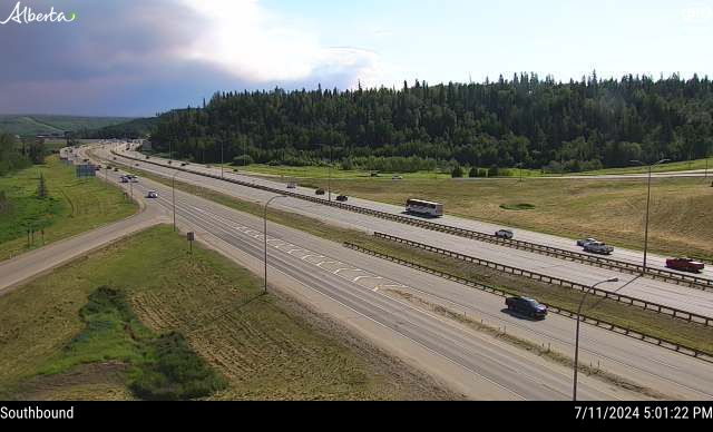 A traffic camera image from Highway 63 and Thickwood Blvd. in Fort McMurray showing wildfire smoke moving in on Thursday, July 11, 2024.