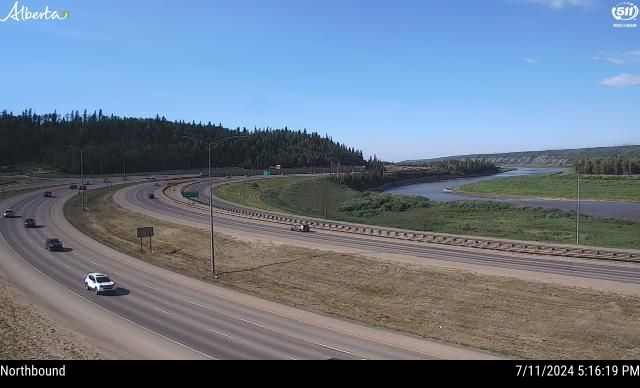 A northbound traffic camera image from Highway 63 and Memorial Bridge in Fort McMurray showing clear skies on Thursday, July 11, 2024.