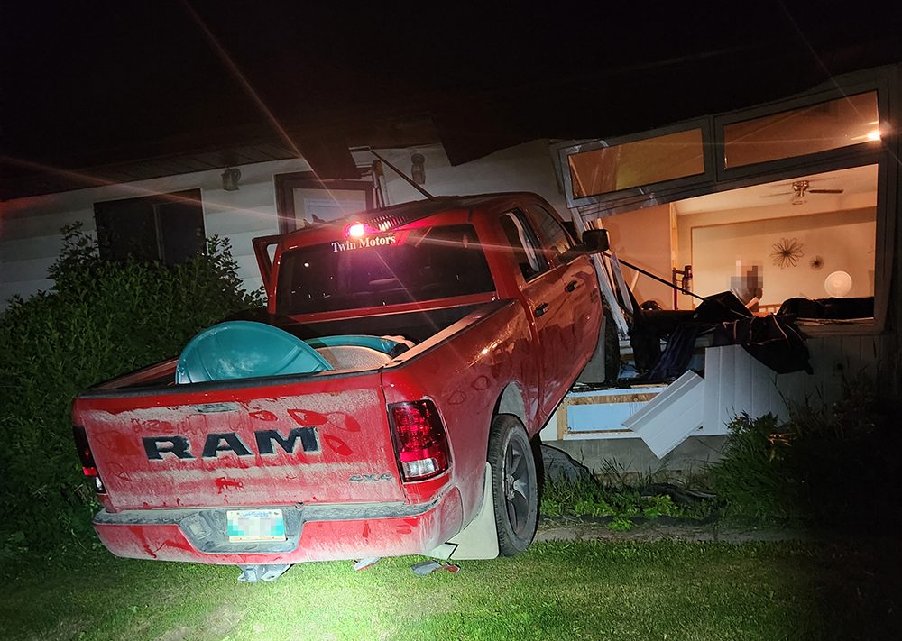 Manitoba RCMP are investigating after this vehicle crashed into a Thompson home early Saturday.