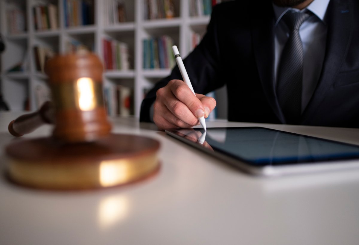 Businessman Signing Digital Contract On Tablet Using Stylus Pen