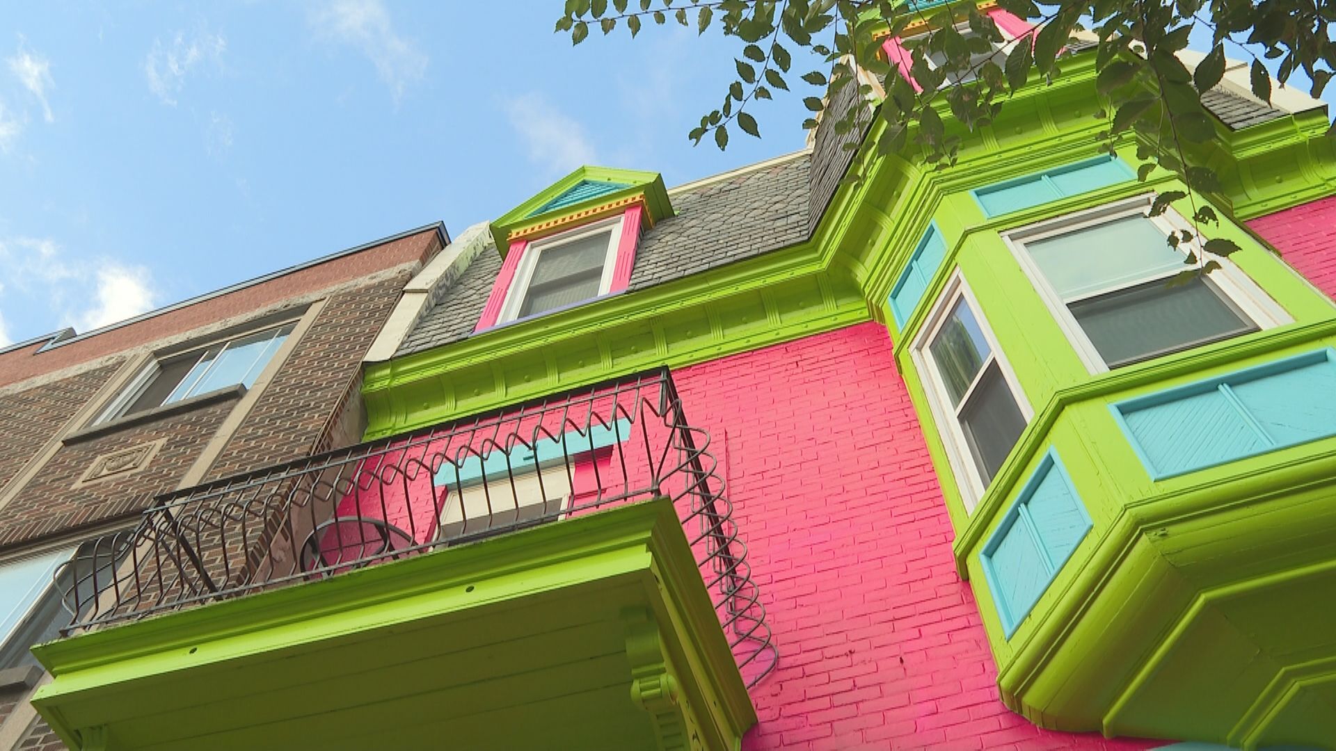 Montreal officials see red after century-old home turned into colourful billboard