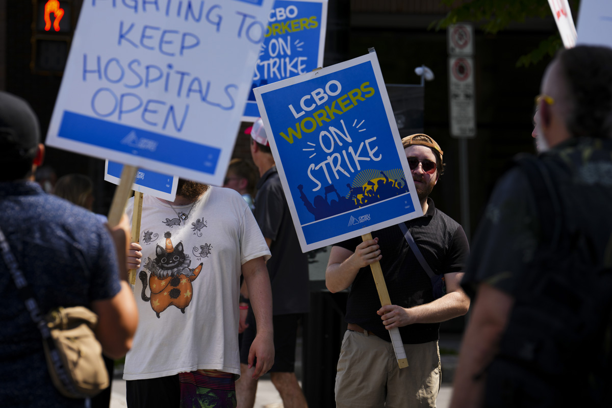 Dozens of LCBO workers rally in downtown Toronto on day 2 of historic strike