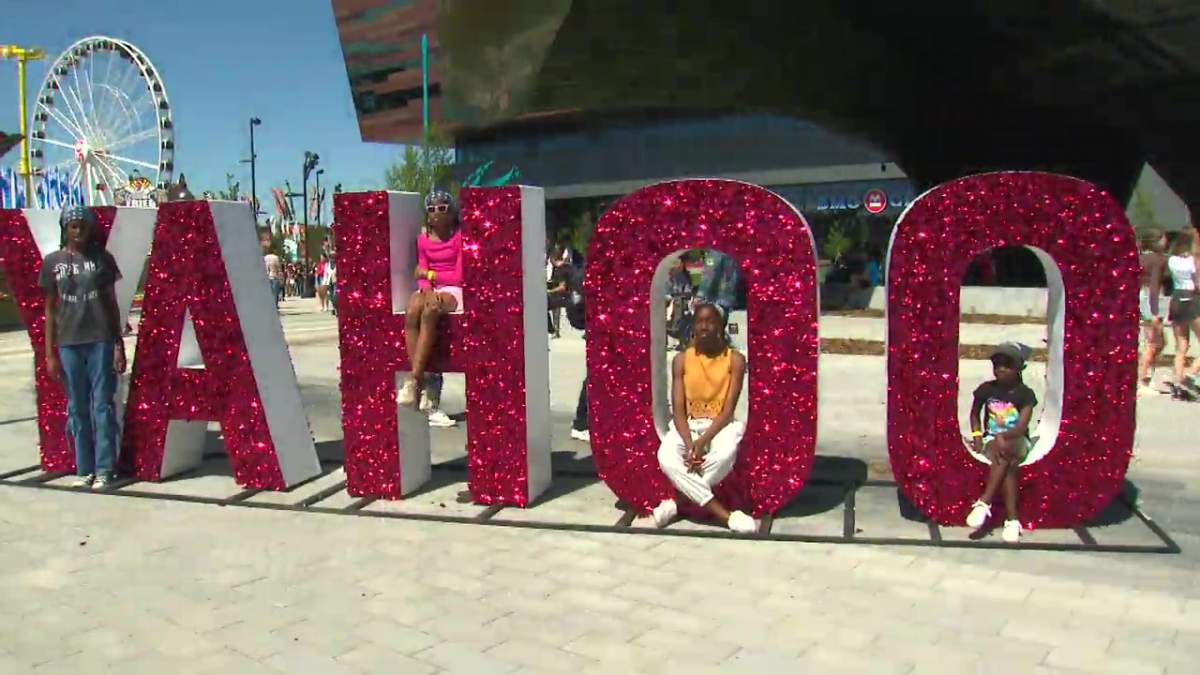 Visitors enjoying the sun on the first day of the 2024 Calgary Stampede.